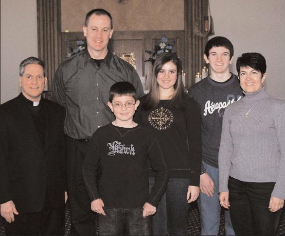 Photo by James A. McBride::Father Cadmus Mazzarella, pastor of Our Lady of Peace Parish in Williamstown, stands with the Bruce family: father Richard, son Nicholas, daughter Rachel, son Alex, and mother Deborah. Richard was on the core team for the merger of St. Mary Church and St. John Neumann Church into Our Lady of Peace Parish, and is a member of the parish’s finance council, and St. Mary School Board. Deborah leads the St. Mary’s Vacation Bible School each summer. Bruce_Rich_OLPeace