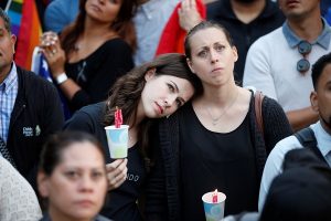Women hold candles during a June 13 vigil in Los Angeles (CNS photo/Lucy Nicholson, Reuters) See ORLANDO-PRAYER-VIGIL June 14, 2016.